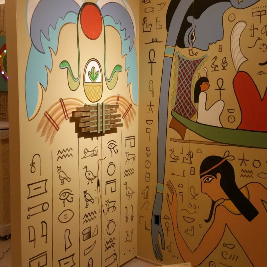escape room wall with hieroglyphics